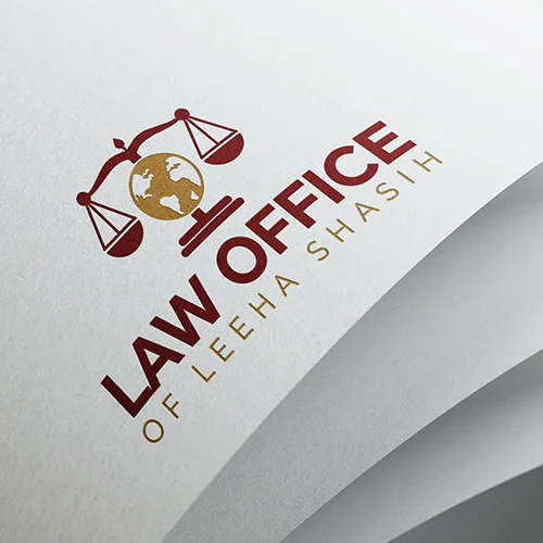 A cup of tea beside a card and leafy greenery.